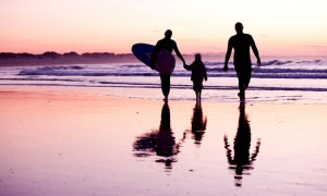 Happy Family surfing at Zavial Beach Ingrina
